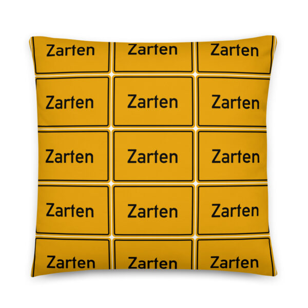 Ein gelbes Kissen mit dem Zarten Basic-Kissen Logo.