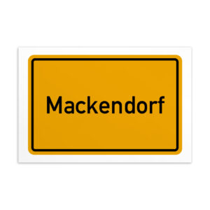 Ein gelbes Schild mit der Aufschrift Mackendorf-Postkarte.